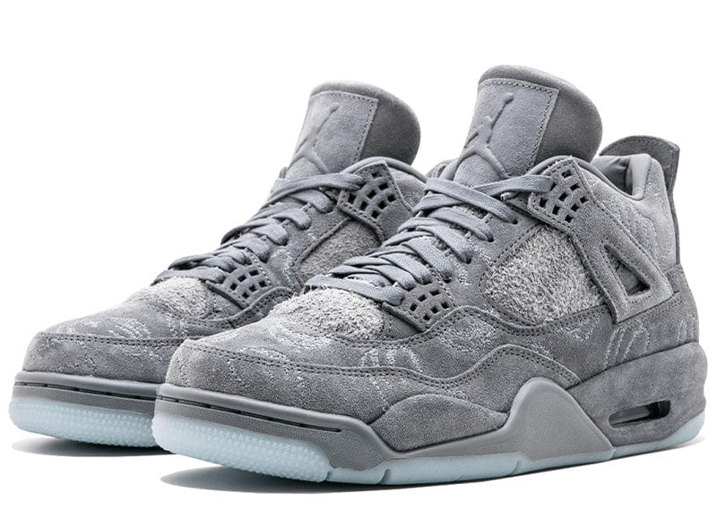 Air Jordan 4 sneakers in grey suede, showcasing legendary style and comfort for streetwear enthusiasts.